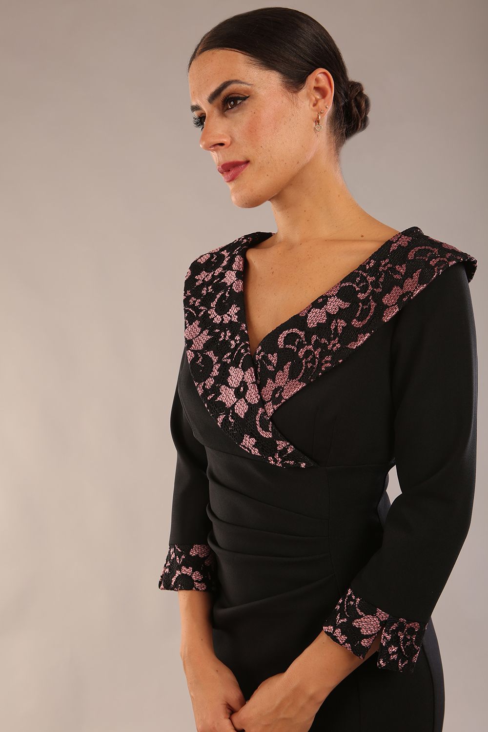 model is wearing a diva catwalk Chantilly Lace Contrast Collar Pencil Dress with contrast lace neckline and cuff and 3/4 sleeve pleating detail knee length pencil dress in black