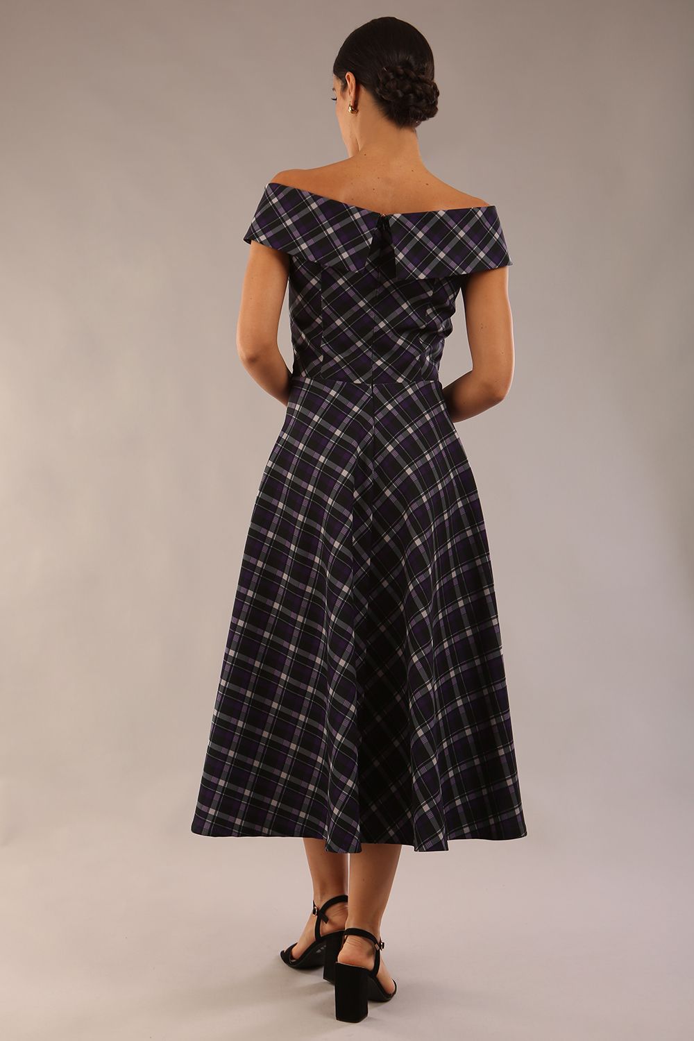 model is wearing a diva catwalk Montclair Tartan Off-Shoulder Midi Dress bardot neckline with tie detail at the waist area a-line style in royal purple tartan colour back