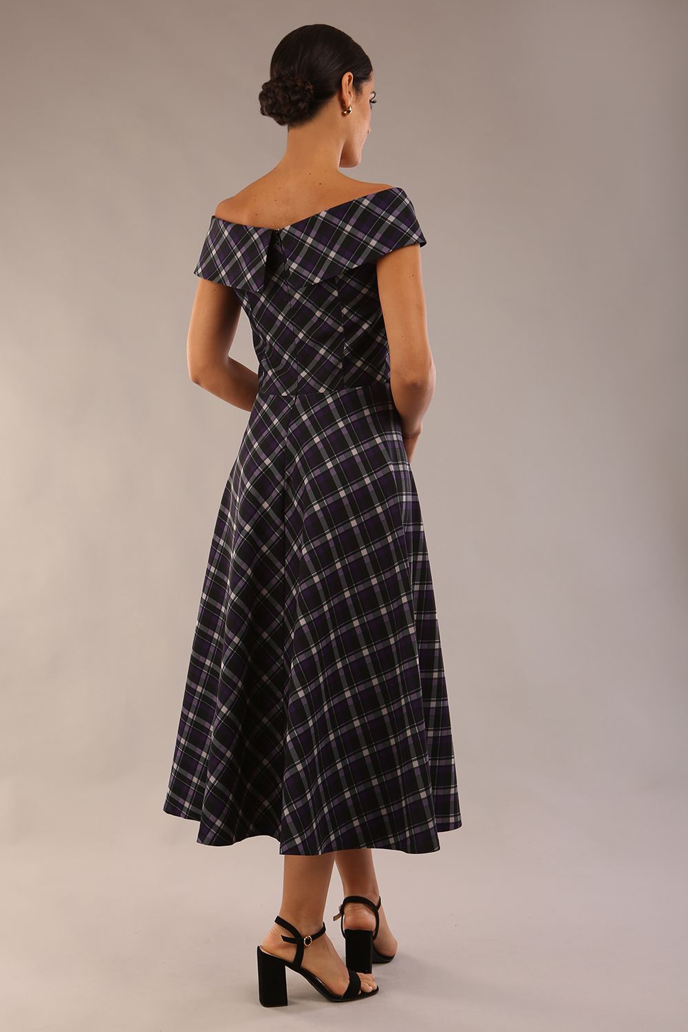 model is wearing a diva catwalk Montclair Tartan Off-Shoulder Midi Dress bardot neckline with tie detail at the waist area a-line style in royal purple tartan colour