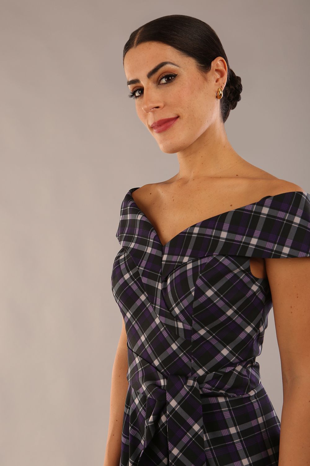 model is wearing a diva catwalk Montclair Tartan Off-Shoulder Midi Dress bardot neckline with tie detail at the waist area a-line style in royal purple tartan colour