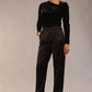 model is wearing a diva catwalk Rhea Satin Stretch Trousers with side pockets and concealed side zip and long leg in black satin