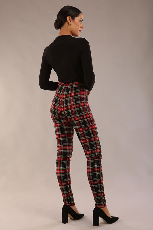 model is wearing a diva catwalk skinny fit Cressida Tartan Stretch Trousers in royal red tartan colour 