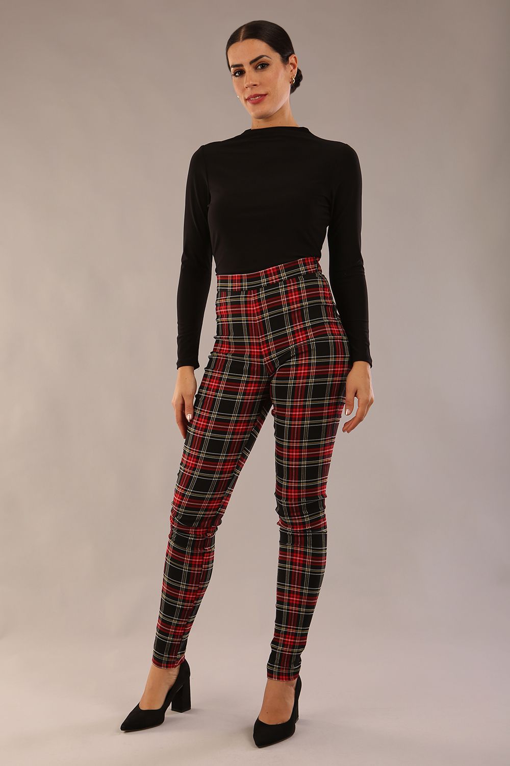 model is wearing a diva catwalk skinny fit Cressida Tartan Stretch Trousers in royal red tartan colour 