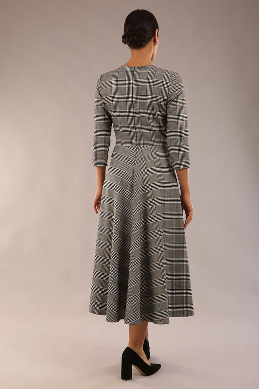 model is wearing a diva catwalk Elanore Soft-Touch Check A-Line Dress with round neckline and 3/4 sleeves midi length and faux pocket with button details in misty grey check colour back