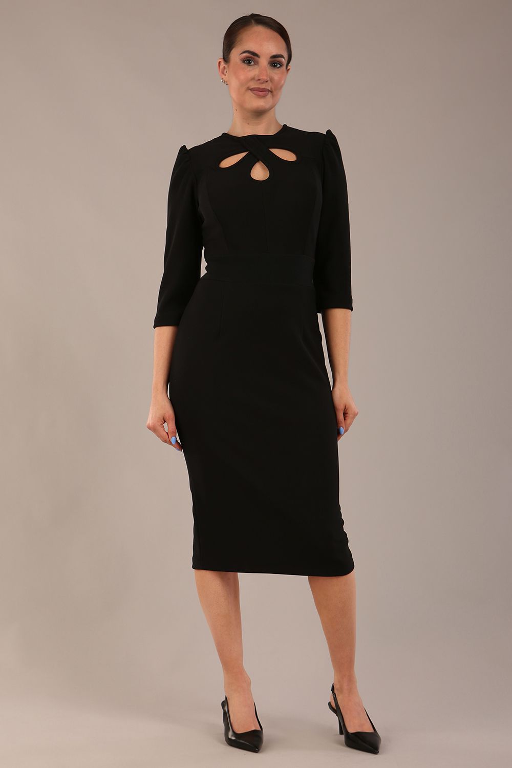 model is wearing a diva catwalk Quintessa Three Petal Keyhole Pencil Dress with 3/4 sleeves round neckline a below the knee length in black colour