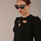 model is wearing a diva catwalk Quintessa Three Petal Keyhole Pencil Dress with 3/4 sleeves round neckline a below the knee length in black colour