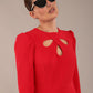 model is wearing a diva catwalk Quintessa Three Petal Keyhole Pencil Dress with 3/4 sleeves round neckline a below the knee length in red colour