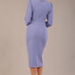 model is wearing a diva catwalk Quintessa Three Petal Keyhole Pencil Dress with 3/4 sleeves round neckline a below the knee length in vista blue colour back