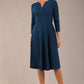 brunette model is wearing a diva catwalk Haddington sleeved A-line Dress knee length round neckline with crossover v-slit detail in teal colour front image