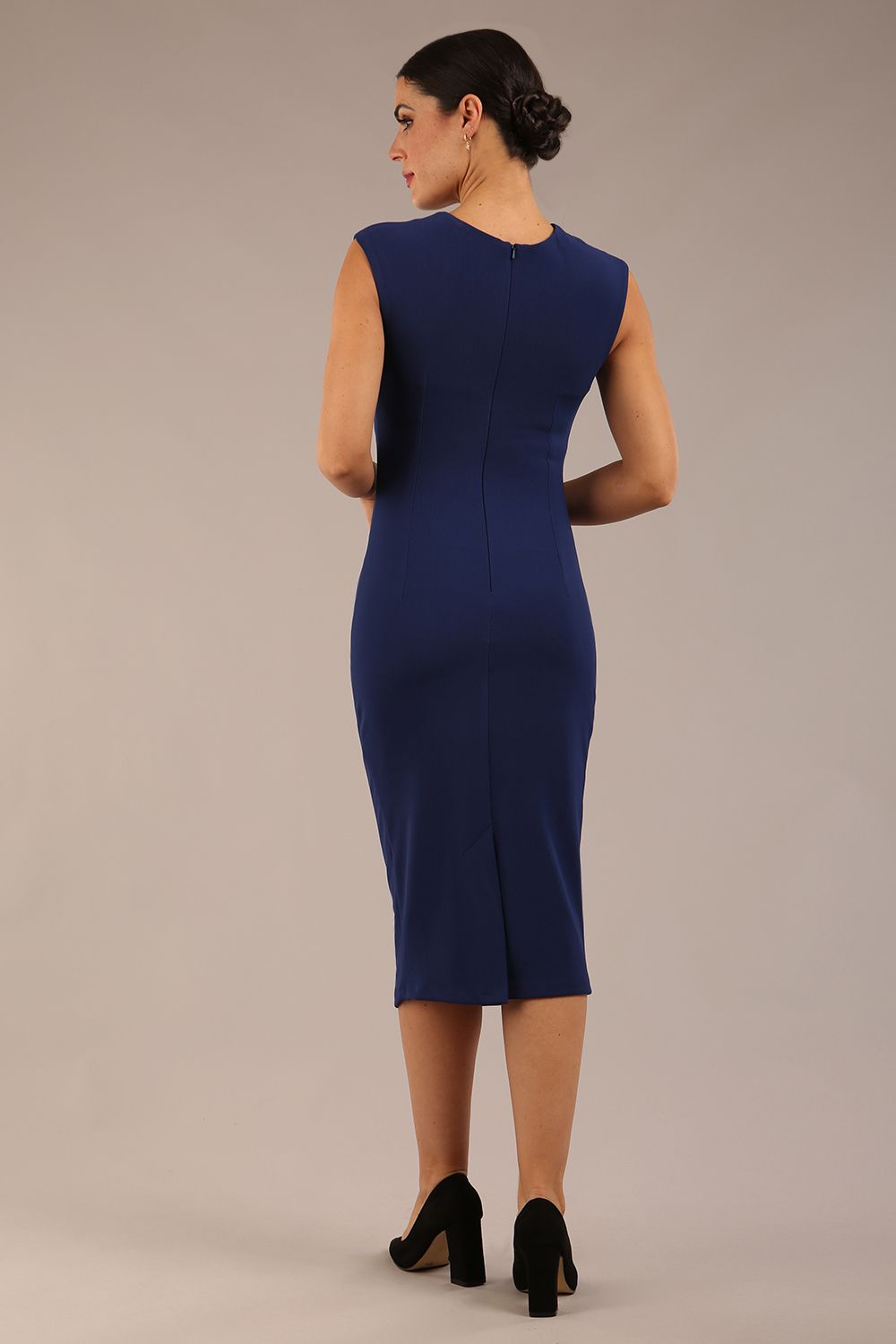 model is wearing a diva catwalk sleeveless dress with round neckline with pleating details and knee length in navy blue colour back