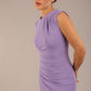 model is wearing a diva catwalk sleeveless dress with round neckline with pleating details and knee length in violet purple colour 