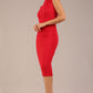 model is wearing a diva catwalk sleeveless dress with round neckline with pleating details and knee length in true red colour 