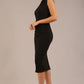 model is wearing a diva catwalk sleeveless dress with round neckline with pleating details and knee length in black colour front