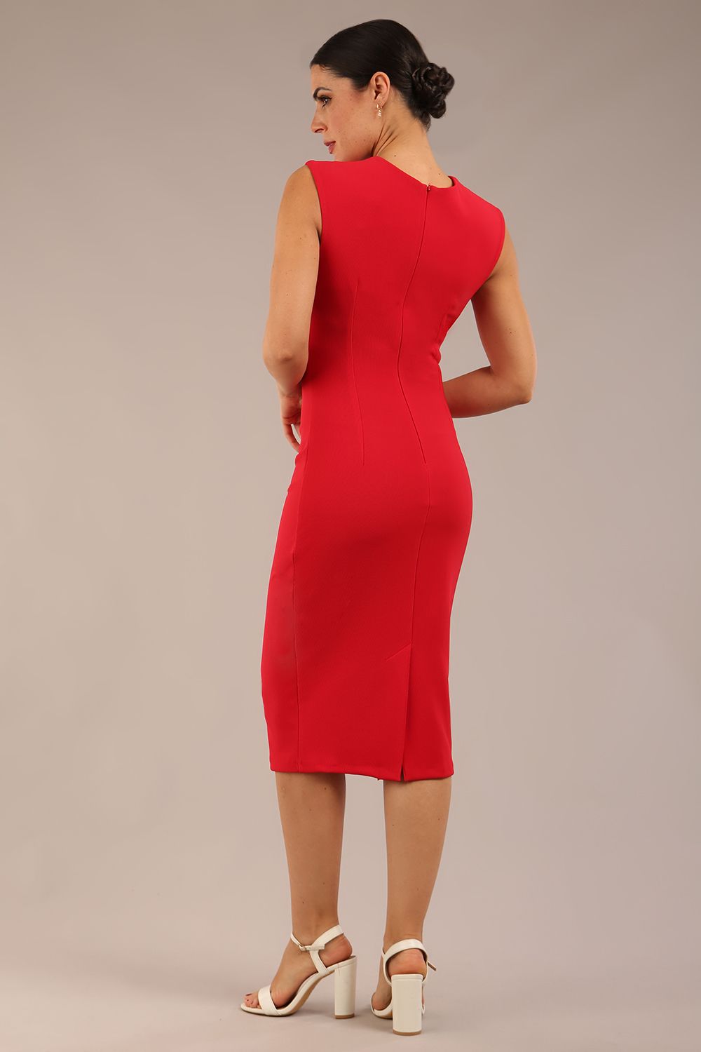 model is wearing a diva catwalk sleeveless dress with round neckline with pleating details and knee length in true red colour back
