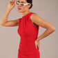 model is wearing a diva catwalk sleeveless dress with round neckline with pleating details and knee length in true red colour 