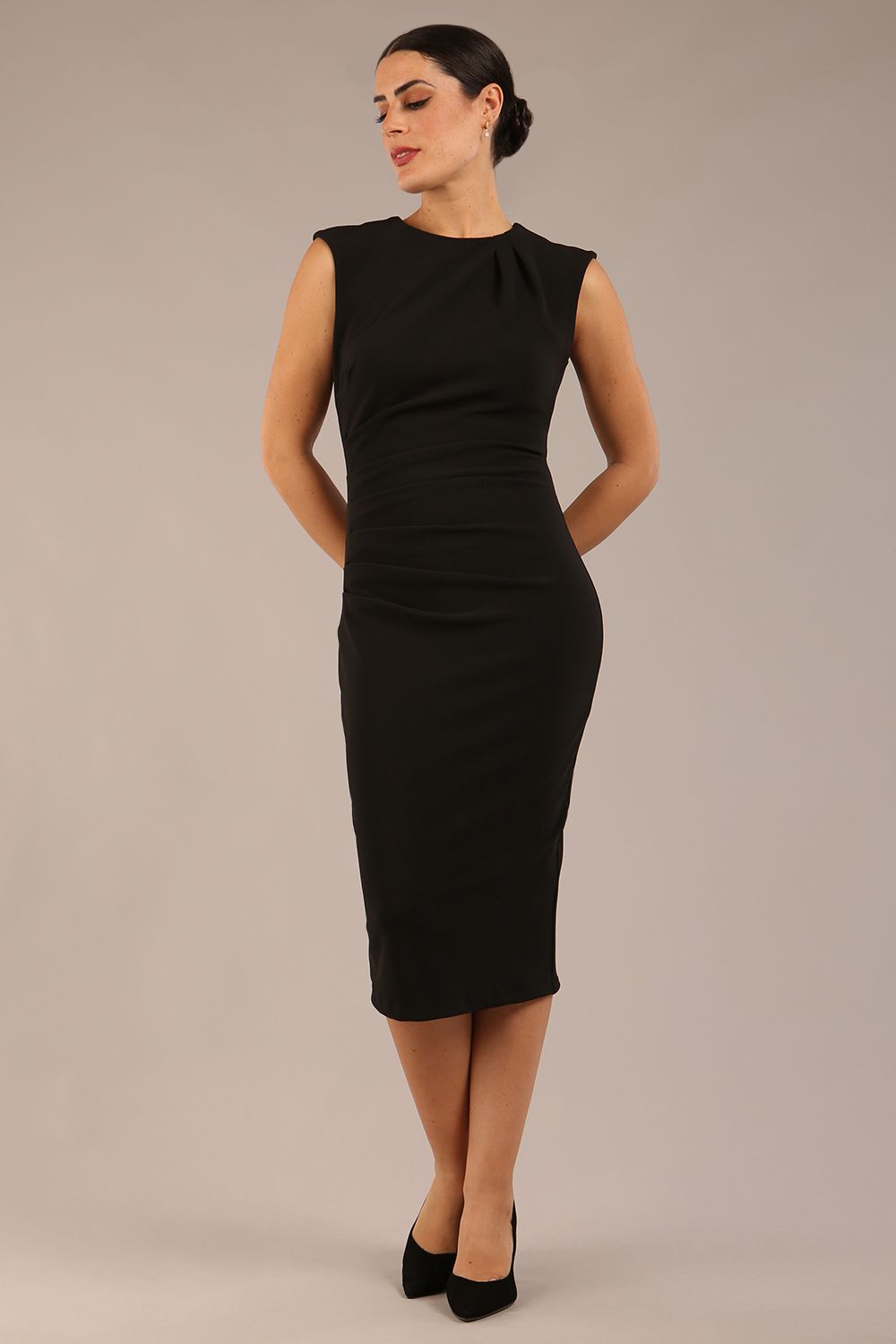 model is wearing a diva catwalk sleeveless dress with round neckline with pleating details and knee length in black colour front