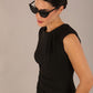 model is wearing a diva catwalk sleeveless dress with round neckline with pleating details and knee length in black colour front