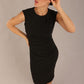 model is wearing a diva catwalk sleeveless dress with round neckline with pleating details and knee length in black colour front