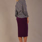 Profile view of the model wearing the Alpha top, highlighting the fit and long sleeves.