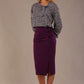 Blonde model wearing a purple Claudette pencil skirt, showing the profile view with side buttons.