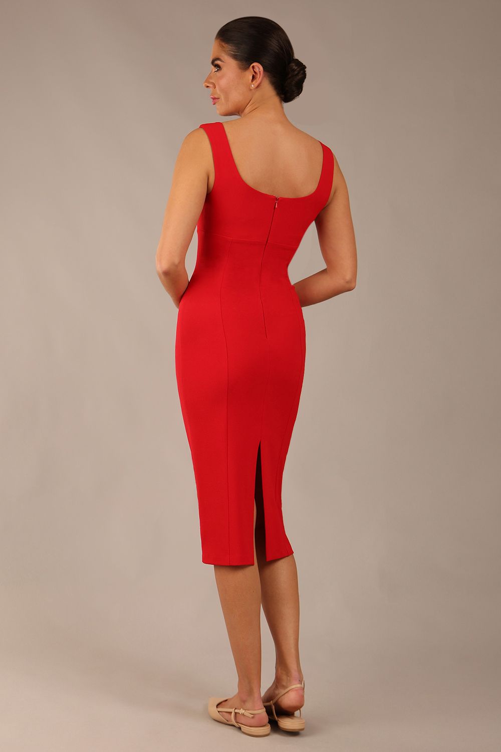 brunette model is wearing a diva catwalk Perthshire Sleeveless Bodycon Pencil Dress square neckline in passion red colour back image