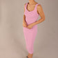 brunette model is wearing a diva catwalk Perthshire Sleeveless Bodycon Pencil Dress square neckline in dawn pink colour front image 