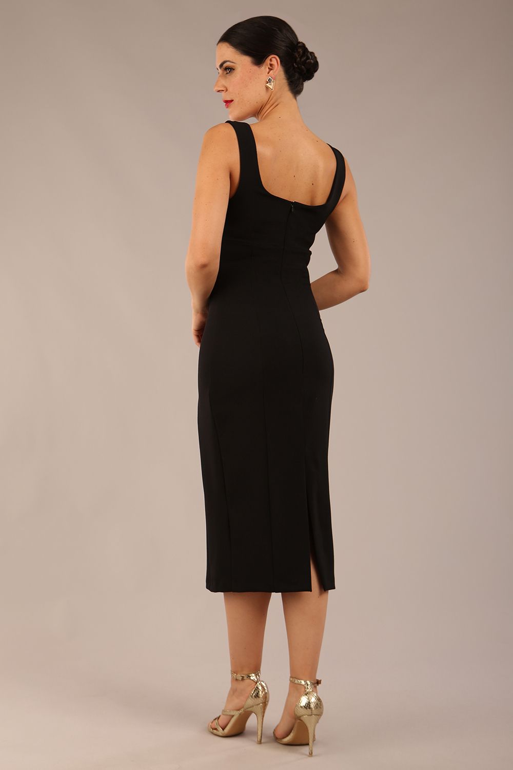 brunette model is wearing a diva catwalk Perthshire Sleeveless Bodycon Pencil Dress square neckline in black colour back image 