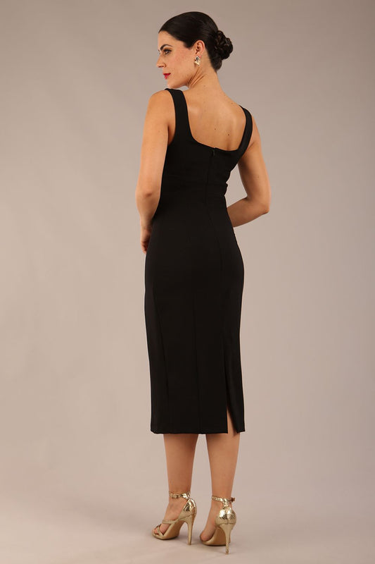 brunette model is wearing a diva catwalk Perthshire Sleeveless Bodycon Pencil Dress square neckline in black colour back image 