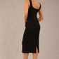 brunette model is wearing a diva catwalk Perthshire Sleeveless Bodycon Pencil Dress square neckline in black colour back image 