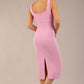 brunette model is wearing a diva catwalk Perthshire Sleeveless Bodycon Pencil Dress square neckline in dawn pink colour back image 