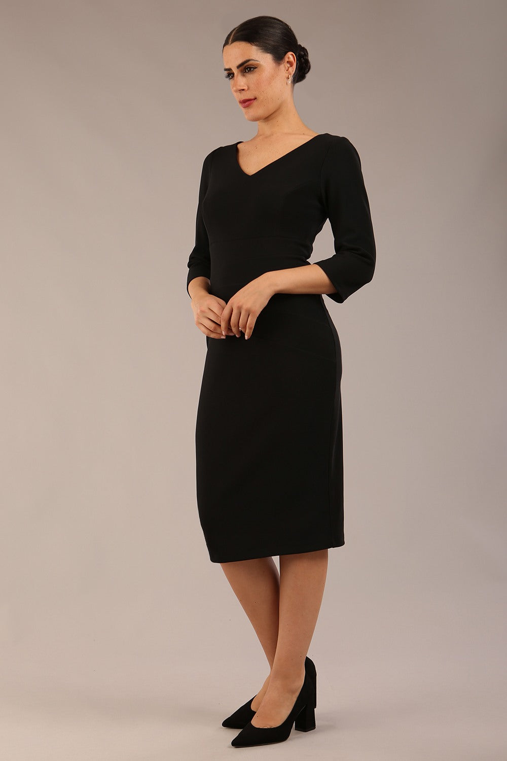 brunette model is wearing a  diva catwalk Tara V-neckline Sleeved Pencil Dress knee length in black colour front image