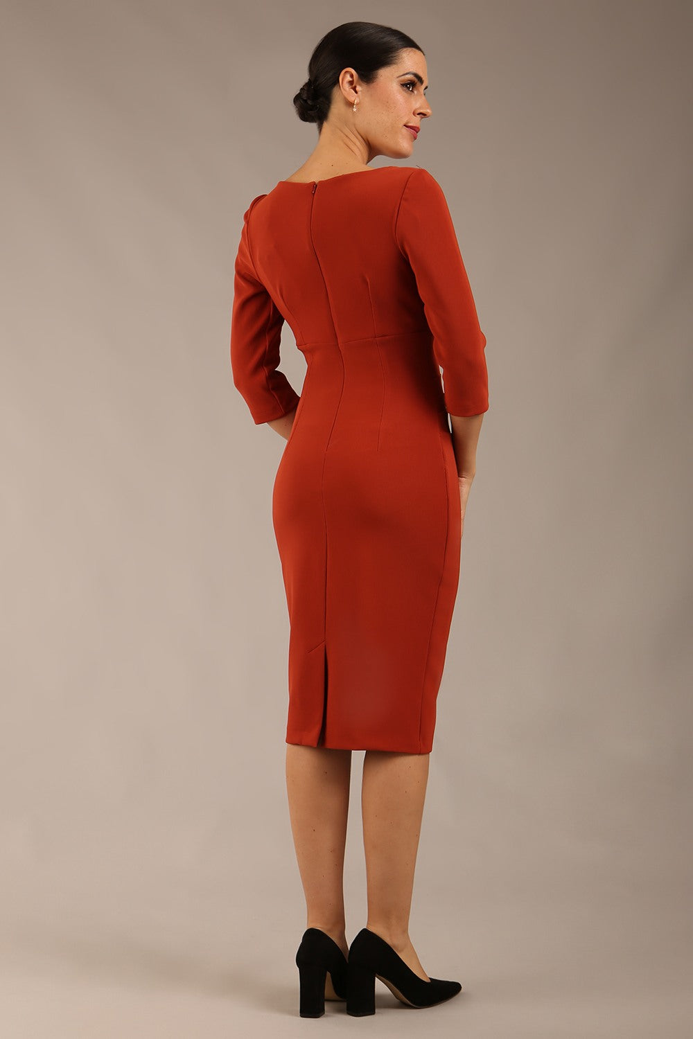 brunette model is wearing a  diva catwalk Tara V-neckline Sleeved Pencil Dress knee length in terracotta brown colour back image 