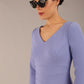 brunette model is wearing a  diva catwalk Tara V-neckline Sleeved Pencil Dress knee length in vista blue colour front image with sunglasses