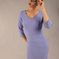 brunette model is wearing a  diva catwalk Tara V-neckline Sleeved Pencil Dress knee length in vista blue colour front image with sunglasses