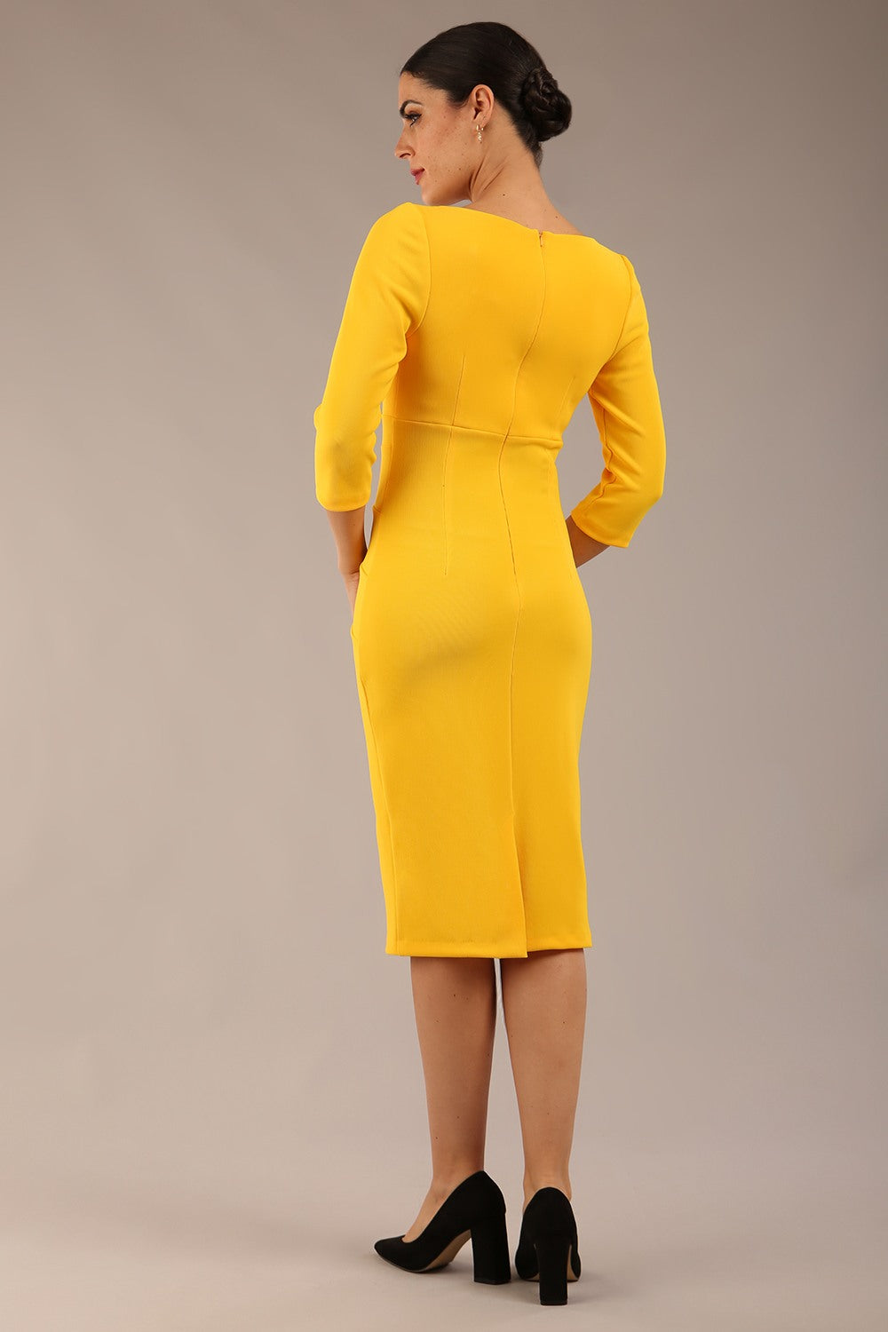 brunette model is wearing a  diva catwalk Tara V-neckline Sleeved Pencil Dress knee length in sunshine yellow colour back image