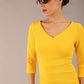 brunette model is wearing a  diva catwalk Tara V-neckline Sleeved Pencil Dress knee length in sunshine yellow colour front image with sunglasses