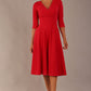 brunette model is wearing a diva catwalk Fabienne sleeved A-line Dress with pockets v neckline knee length wide waistband fold over v neckline in electric red colour front image