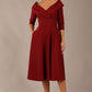 brunette model is wearing a diva catwalk Fabienne sleeved A-line Dress with pockets v neckline knee length wide waistband fold over v neckline in burgundy colour front image