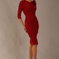 brunette model is wearing a diva catwalk Mirabelle ¾ Sleeves & Floral Shoulder Detail Pencil Dress with diagonal pleating across the front knee length in rosewood red colour front image
