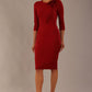 brunette model is wearing a diva catwalk Mirabelle ¾ Sleeves & Floral Shoulder Detail Pencil Dress with diagonal pleating across the front knee length in rosewood red colour front image