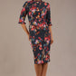 Model wearing the Portofino frill neck floral jacquard dress against a plain background (Hidcote Floral)