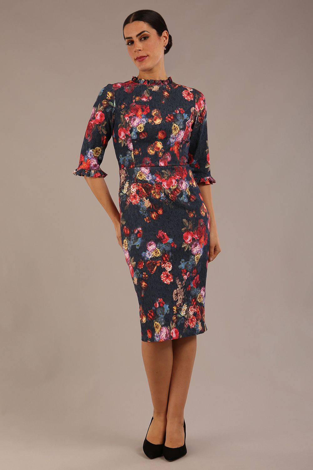 Model wearing the Portofino frill neck floral jacquard dress against a plain background (Hidcote Floral)