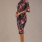 Model wearing the Portofino frill neck floral jacquard dress against a plain background (Hidcote Floral)