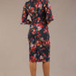 back view Model wearing the Portofino frill neck floral jacquard dress against a plain background (Hidcote Floral)