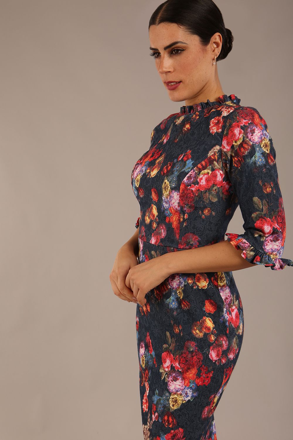 Model wearing the Portofino frill neck floral jacquard dress against a plain background (Hidcote Floral)