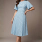 brunette model is wearing a diva catwalk Anastasia Polka Dot Bell Sleeves & A-Line Skirt Midi Dress a-line dress in sky blue polka dot front image (Sky Blue Polka Dot)
