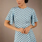 brunette model is wearing a diva catwalk Anastasia Polka Dot Bell Sleeves & A-Line Skirt Midi Dress a-line dress in sky blue polka dot front image (Sky Blue Polka Dot)