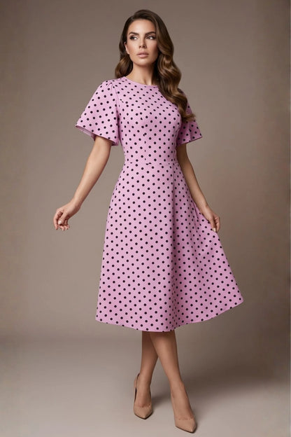 brunette model is wearing a diva catwalk Anastasia Polka Dot Bell Sleeves & A-Line Skirt Midi Dress a-line dress in orchid polka dot front image (Orchid Polka Dot)