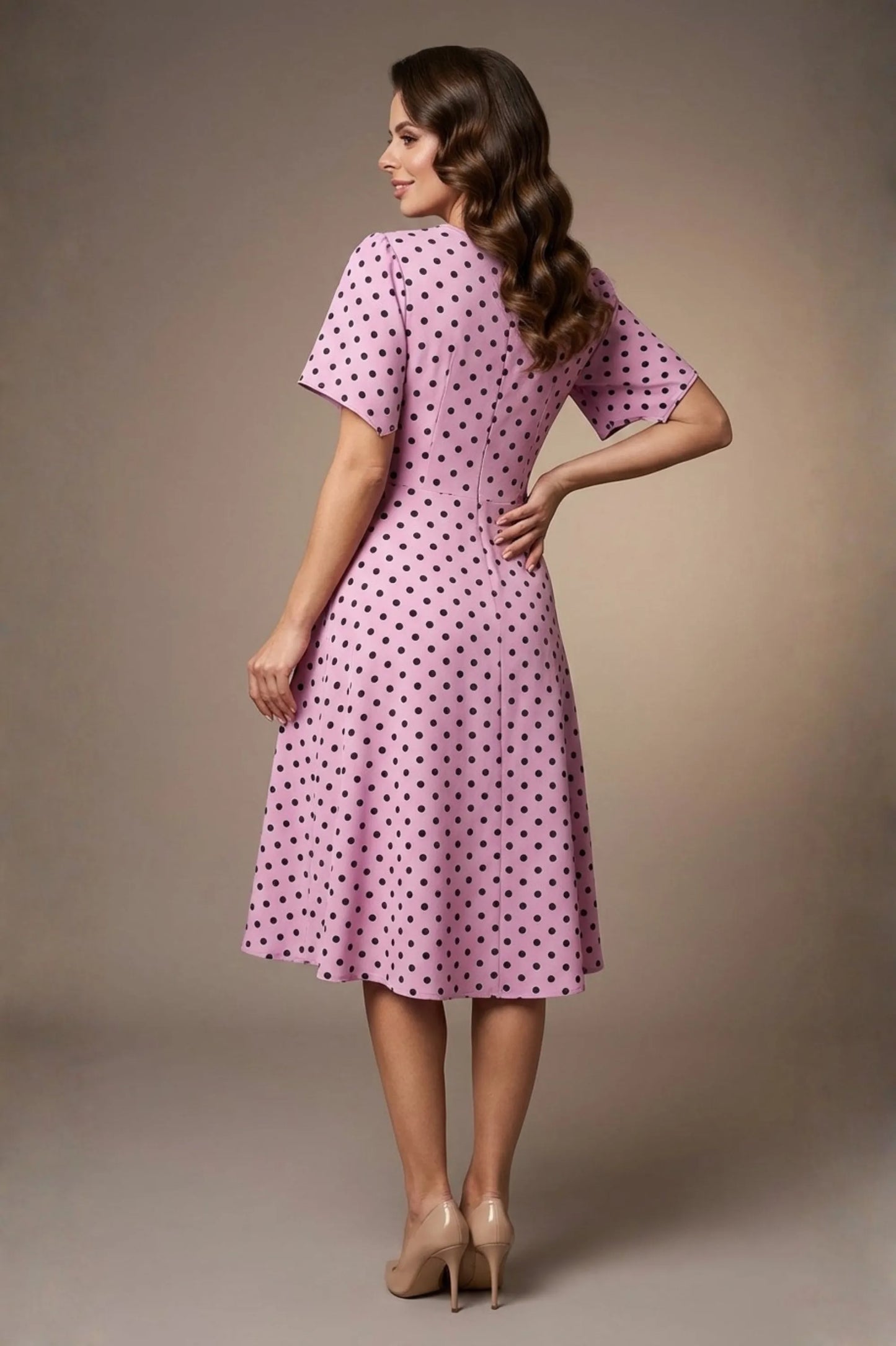 brunette model is wearing a diva catwalk Anastasia Polka Dot Bell Sleeves & A-Line Skirt Midi Dress a-line dress in orchid polka dot front image (Orchid Polka Dot)