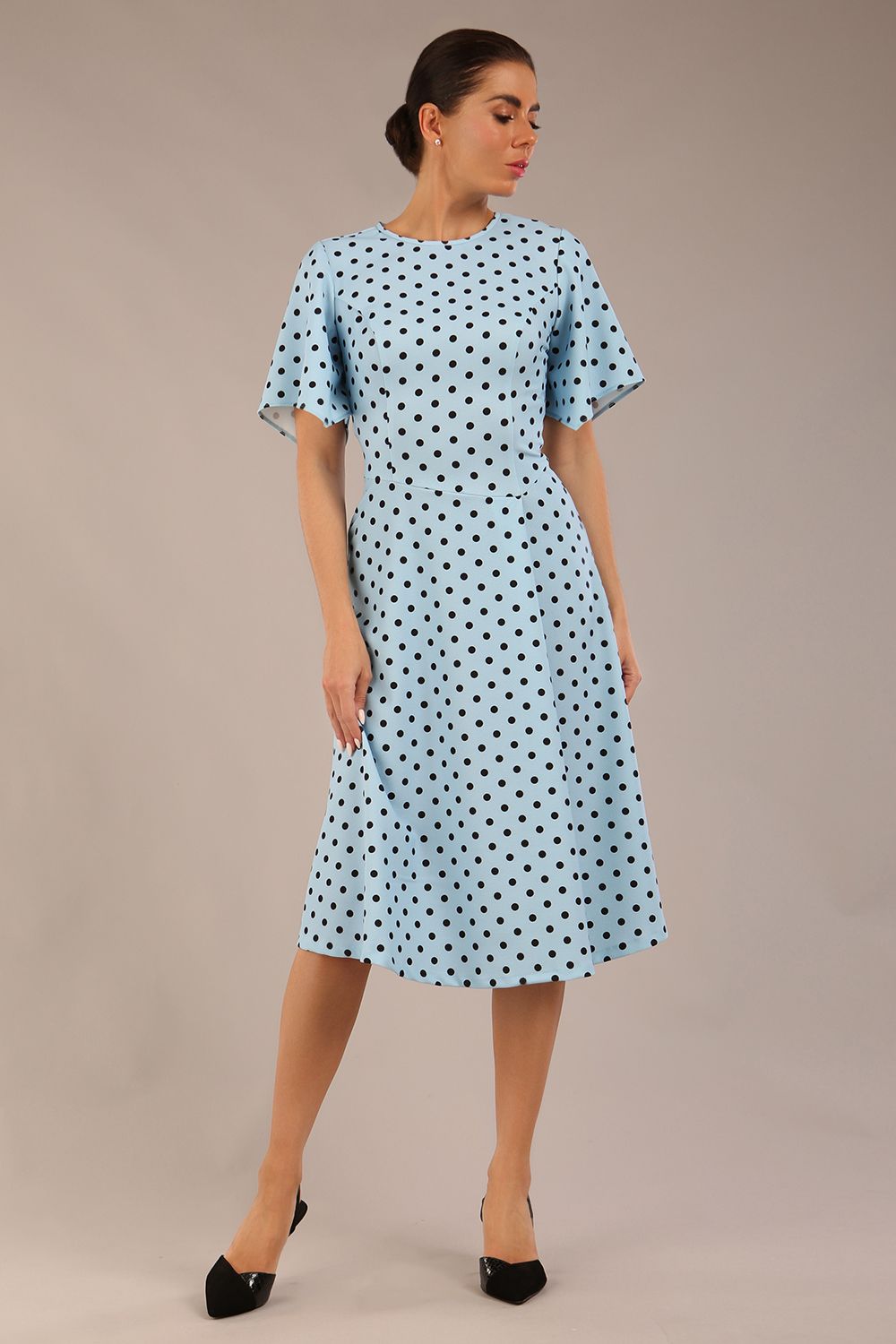 brunette model is wearing a diva catwalk Anastasia Polka Dot Bell Sleeves & A-Line Skirt Midi Dress a-line dress in sky blue polka dot front image